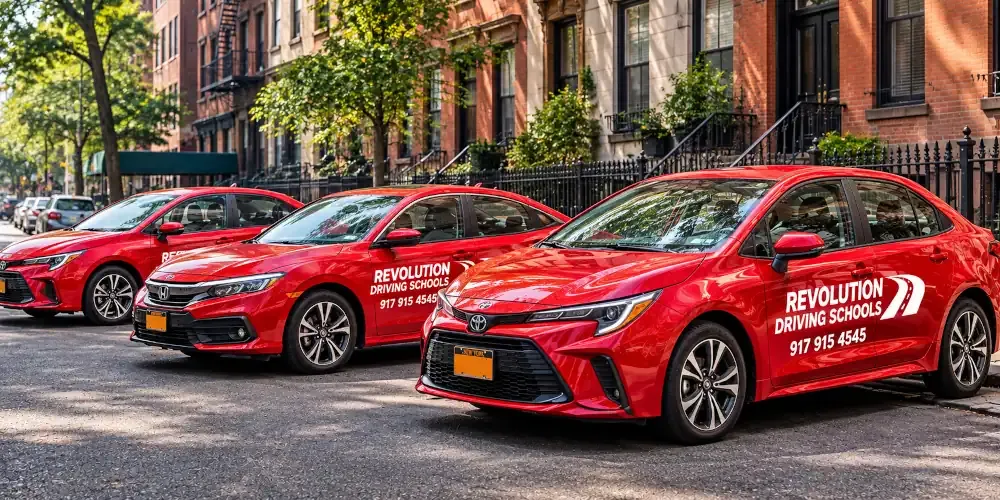 Revolution Driving Schools fleet of red cars parked on a New York City street